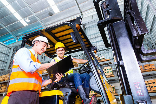 asian-forklift-truck-driver-discussing-checklist-with-foreman-in-warehouse