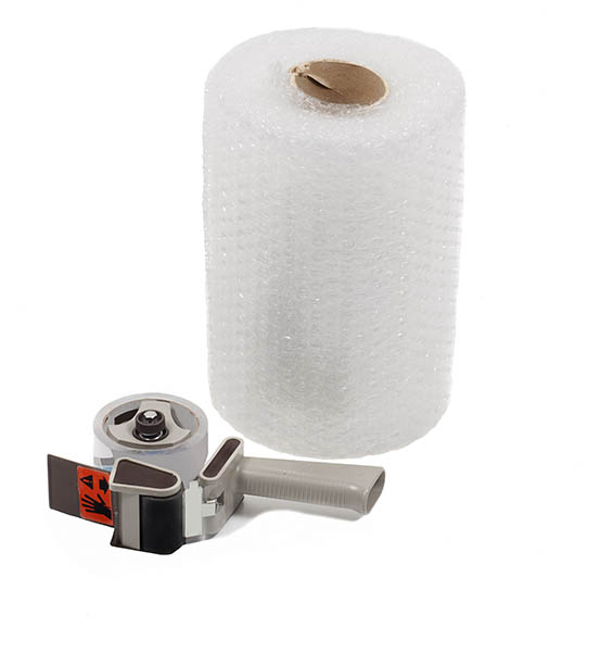 Large roll of bubble wrap and tape dispenser isolated on white