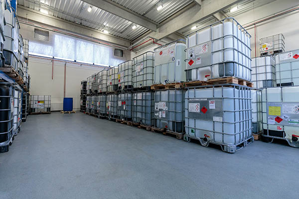 Warehouse with chemicals in IBC containers. IBC is used for storage and transport of chemicals