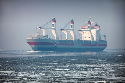 cargo ship navigating icy waters