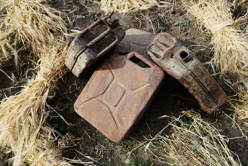 old metallic gasoline jerrican