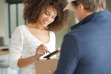 woman receiving package delivery man