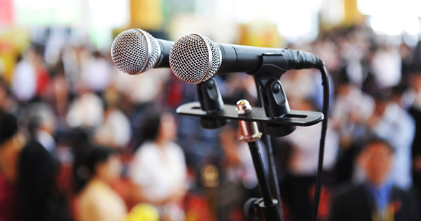pair microphones before crowd