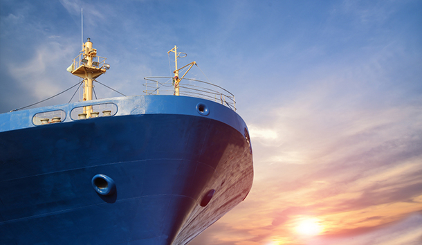 cargo ship forward sunset background