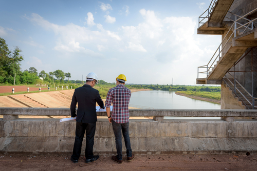 Business men meeting with Engineers