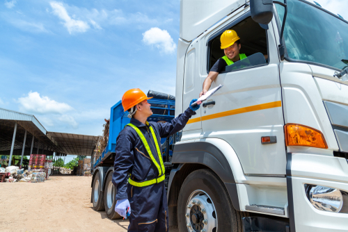truck driver engineer checking recycling list