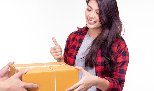 woman accepting boxed delivery