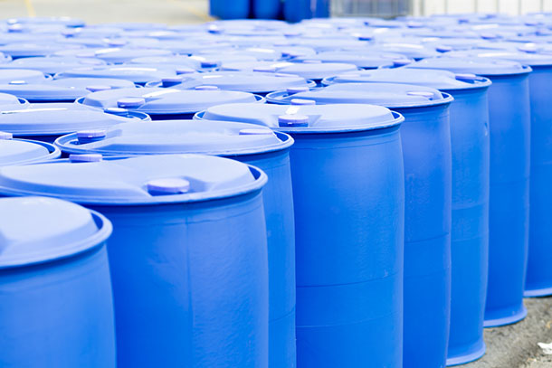 rows of blue plastic drums