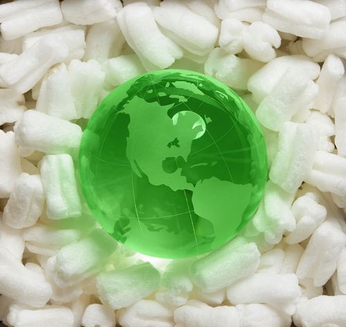 green globe on packing peanuts