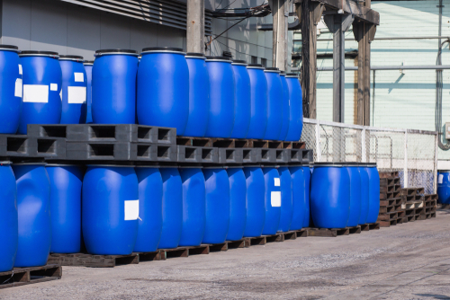 blue plastic chemical drums