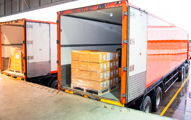 docked truck with cardboard boxes