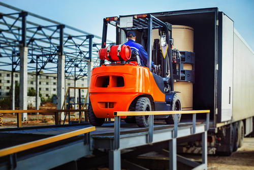 forklift lifting large container
