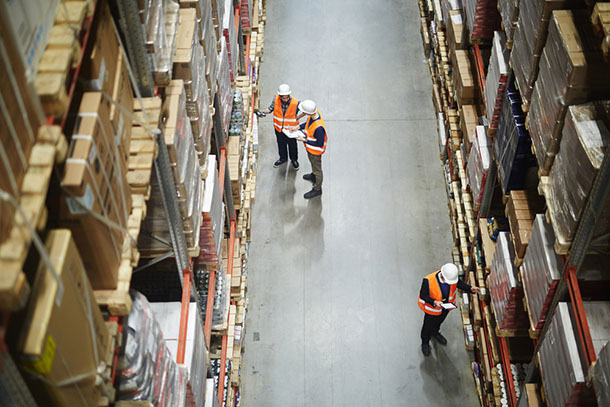 factory supervisors review inventory