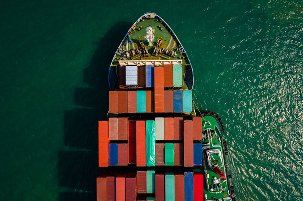 Aerial top view from drone, Container ship or cargo shipping business logistic import and export freight transportation by container ship in open sea,