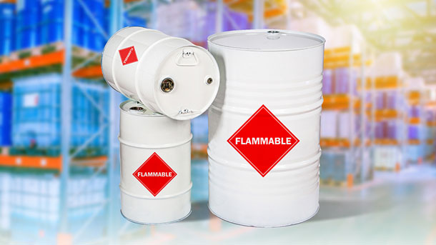 a set of white barrels with a flammable logo