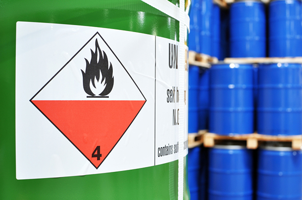 a close up of a barrel with a hazard sign on it