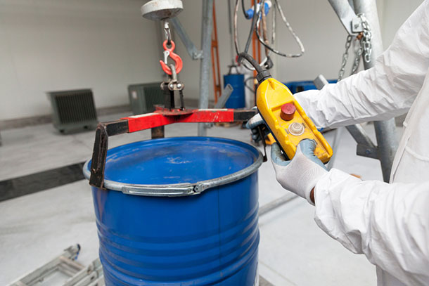a hazmat drum being sealed