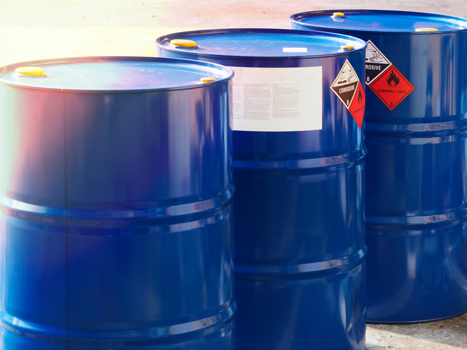 the close-up shot of blue color hazardous dangerous chemical drum barrels