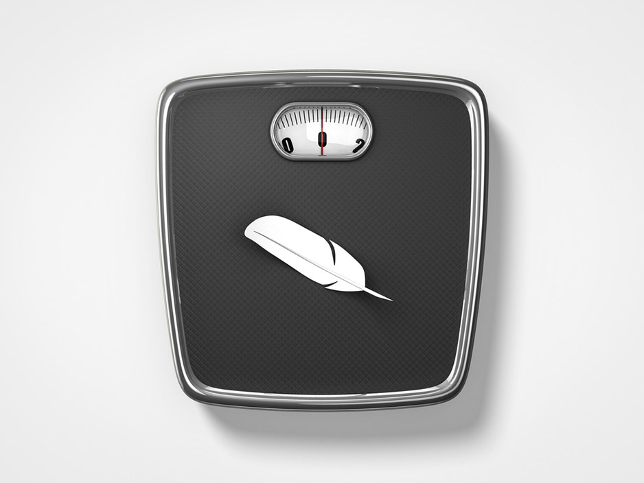 weight scale and a feather